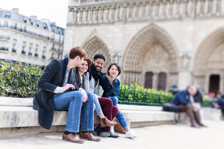 Multi-ethnic Group Of Friends Having Fun In Paris, Notre Dameの写真素材