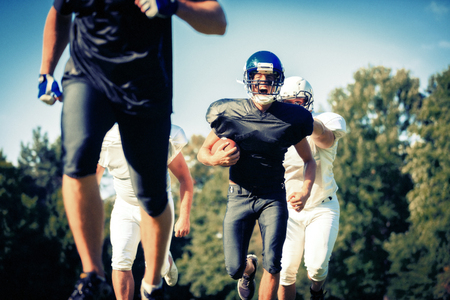 American Football Players Runningの写真素材