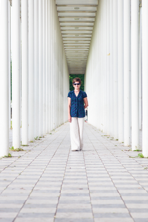 Senior Woman In White Pillar Hallwayの写真素材