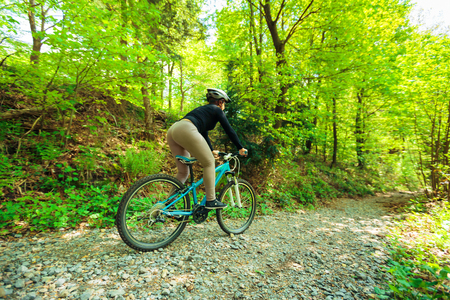 Young Woman Riding Her Mountain Bikeの写真素材