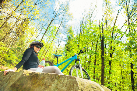 Young Woman Riding Her Mountain Bikeの写真素材