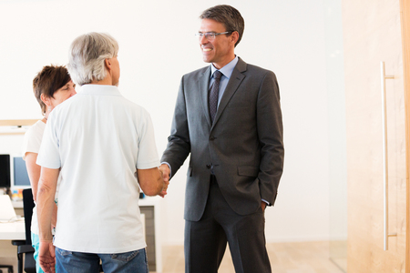 Retired Couple Talking To Their Financial Advisorの写真素材