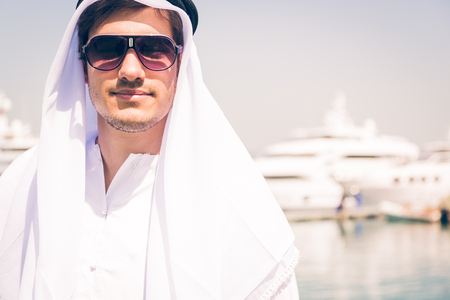 Young Arabian Man Next To A Yacht Portの写真素材