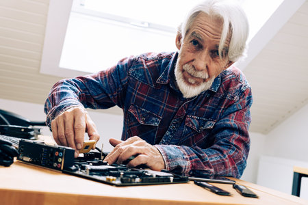 Senior Man Assembling Computer Partsの写真素材