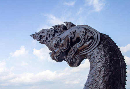 king of nagas statue blue sky backgroundの写真素材