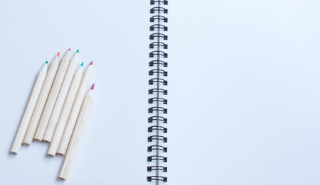 wood colour pencil on white book backgroudの写真素材