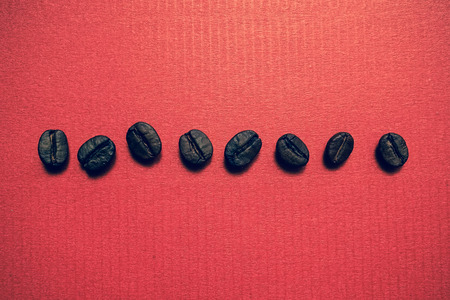 coffee beans on vintage color paper backgroundの写真素材