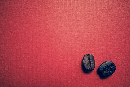 coffee beans on vintage color paper backgroundの写真素材