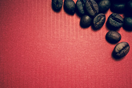 coffee beans on vintage color paper backgroundの写真素材