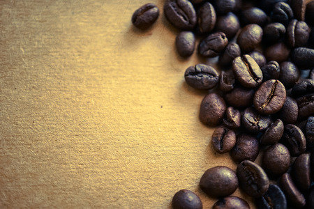 coffee beans on vintage color paper backgroundの写真素材