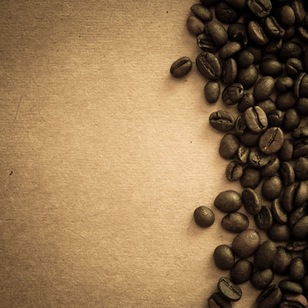 coffee beans on vintage color paper backgroundの写真素材