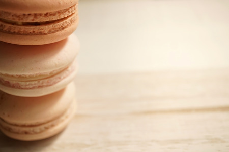 colorful macaroons on white wooden for backgroundの写真素材