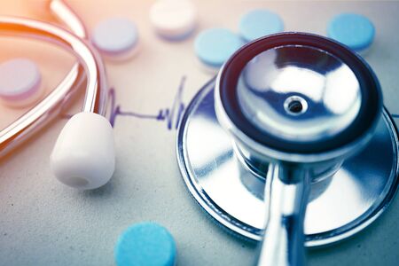 stethoscope and pill medical concept