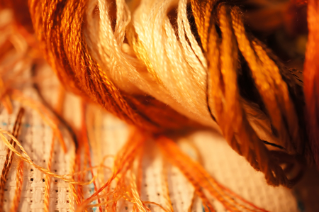 The process of cross stitch , working with the lampの写真素材