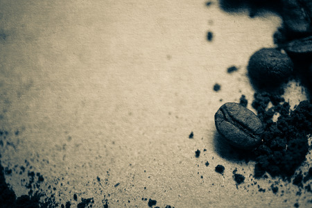 coffee beans on old paper texture for backgroundの写真素材