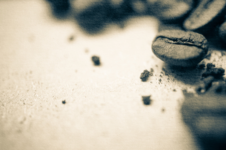 coffee beans on old paper texture for backgroundの写真素材