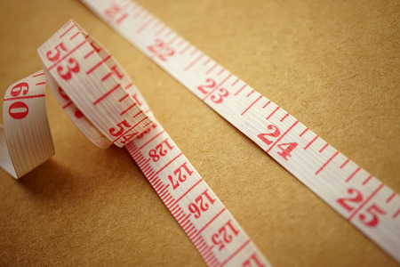 Measuring tape on craft paper for background diet concept
