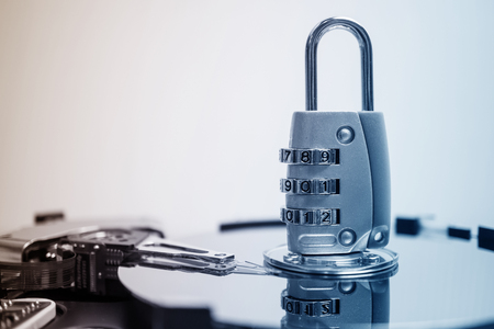 combination padlock on hard disk computer for security data concept