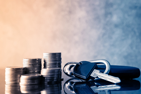 rows of coins and key of car for finance about car conceptの写真素材
