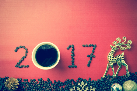 2017 coffee beans and christmas decorations in vintage style for new year conceptの写真素材