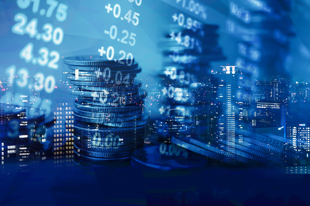 Double exposure of graph and rows of coins for finance and banking conceptの写真素材