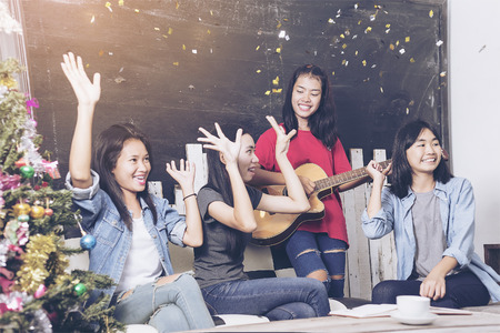 party, holidays, celebration, nightlife and people concept - smiling friends with glasses of non-alcoholic in clubの写真素材