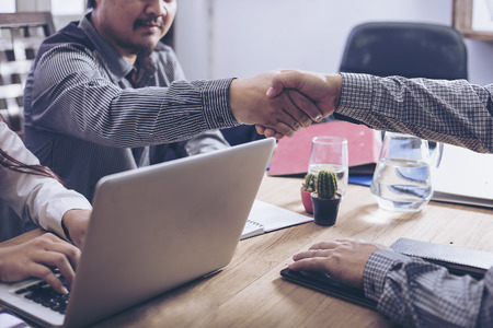 Business people shaking hands, finishing up a meetingの写真素材
