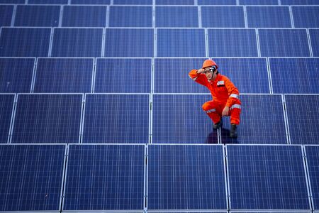 Engineers are checking the solar panel for maintenance. And clean the solar panel is always available.の写真素材