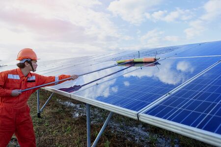 Engineers are checking the solar panel for maintenance. And clean the solar panel is always...