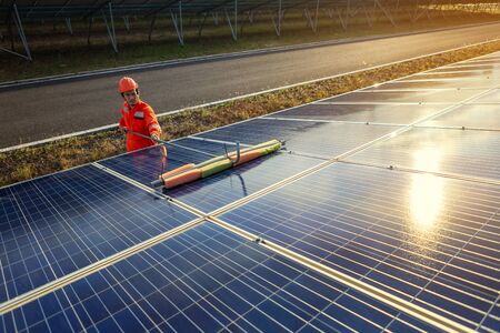 Engineers are checking the solar panel for maintenance. And clean the solar panel is always...