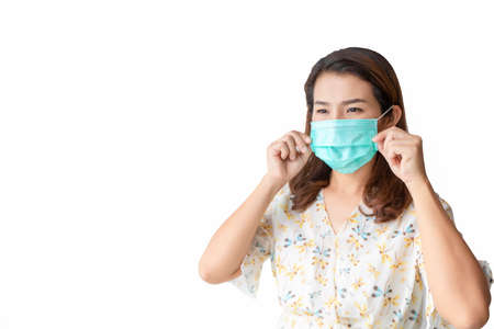 Asian women wear beautiful floral shirts and face masks to prevent the spread of COVID 2019. Health care conceptの写真素材