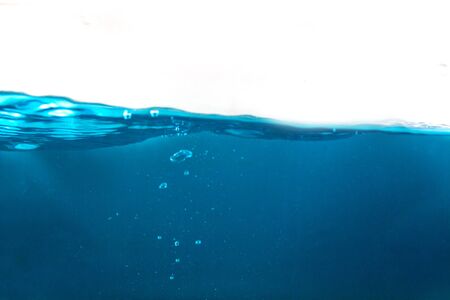 close-up blue water surface with bubble underwater