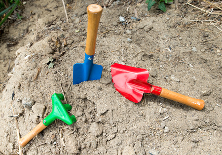 Spade shovel embroidery on the ground.の写真素材