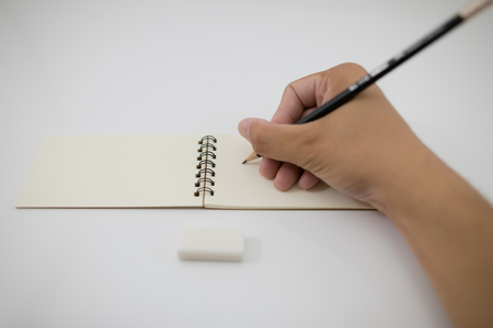 write something down on a notebook.の写真素材