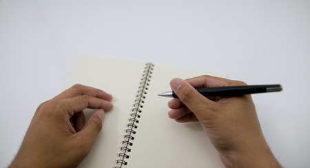 write something down on a notebook.の写真素材