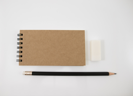 Brown cover notebook with pencil and eraser.の写真素材