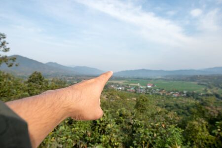 Pointing to the mountainの写真素材