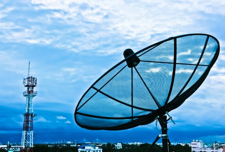 Satellite dishes in the evening for the cityの写真素材
