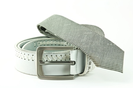 Belt and tie on a white backgroundの写真素材