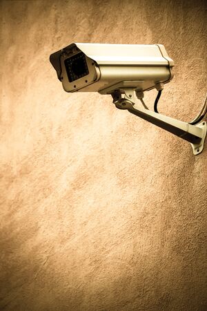 CCTV on a brown wall