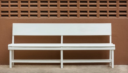 white wooden chair on a brick wallの写真素材