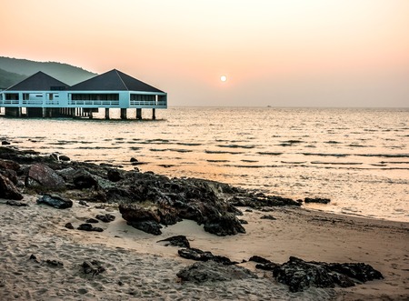 Bungalow near the sea at sunset, so beautifulの写真素材