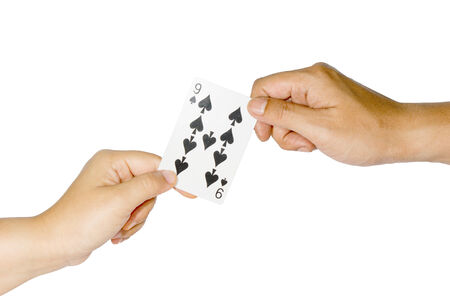 Hands and playing cards isolated on white backgroundの写真素材