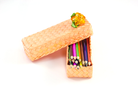 Colorful vertical pencil crayon border over whiteの写真素材