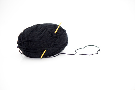 Yarn and crochet hook on a white background.の写真素材