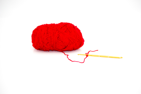 Yarn and crochet hook on a white background.の写真素材