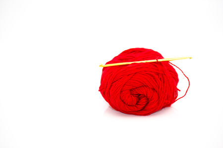 Yarn and crochet hook on a white background.の写真素材