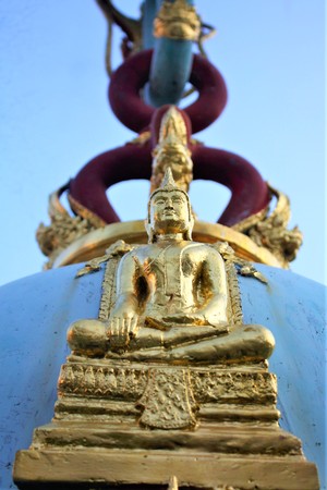 A Buddha Image Attached to A Giant Bell at Wat Khanon Nang Yai Temple in Ratchaburi, Thaialnd