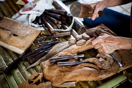 The wood carving which requires skill, experience and imaginationの写真素材