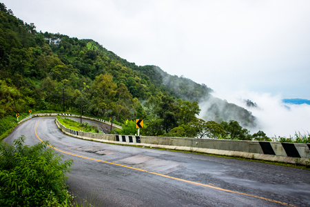 Road and sea fog Doi Ang Khang, Chiang Mai, Thailand's highest mountain.の写真素材